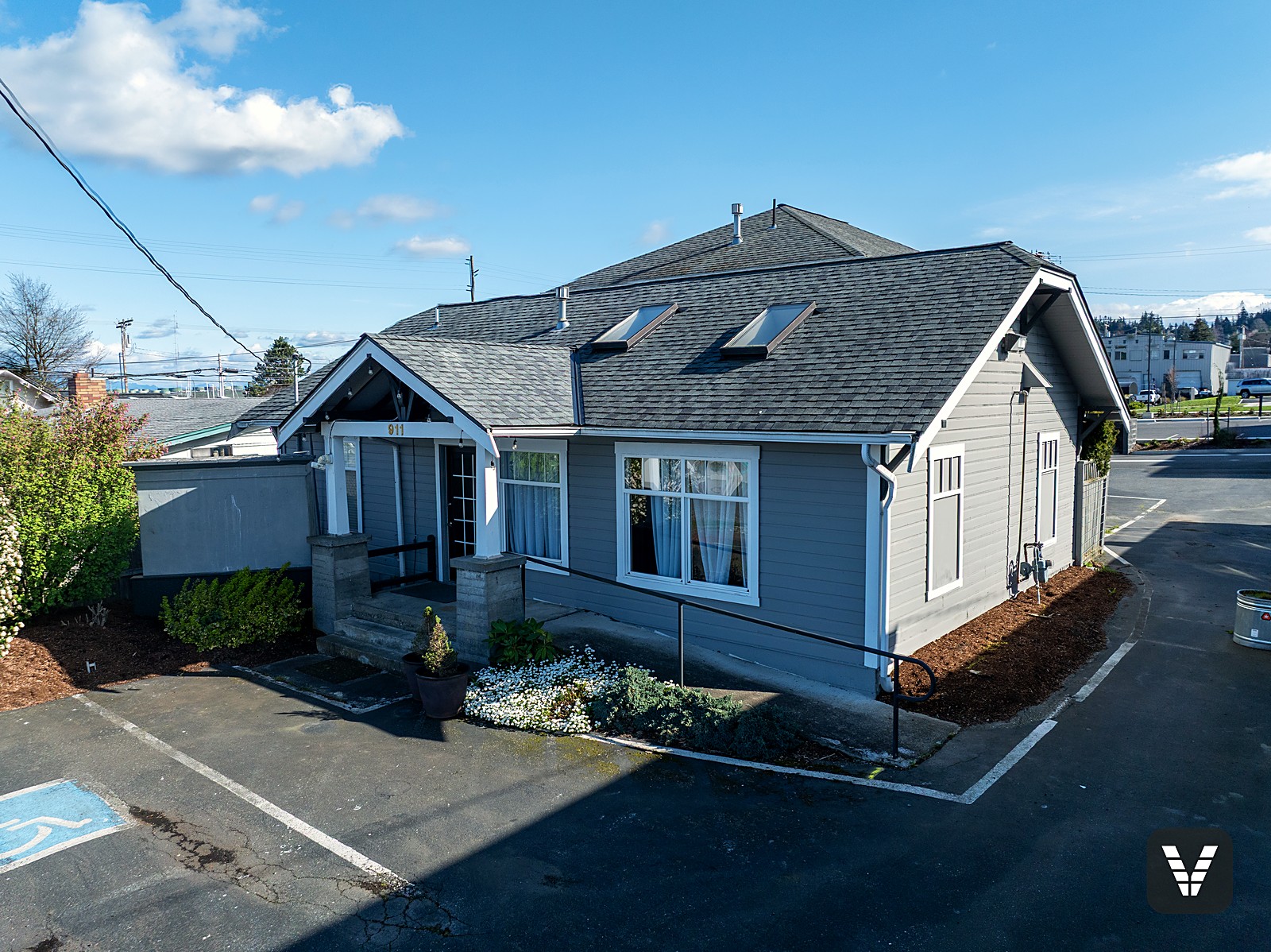 Before the renovation — the craftsman entry of Siding & Window Vault's future Anacortes showroom at 911 29th Street