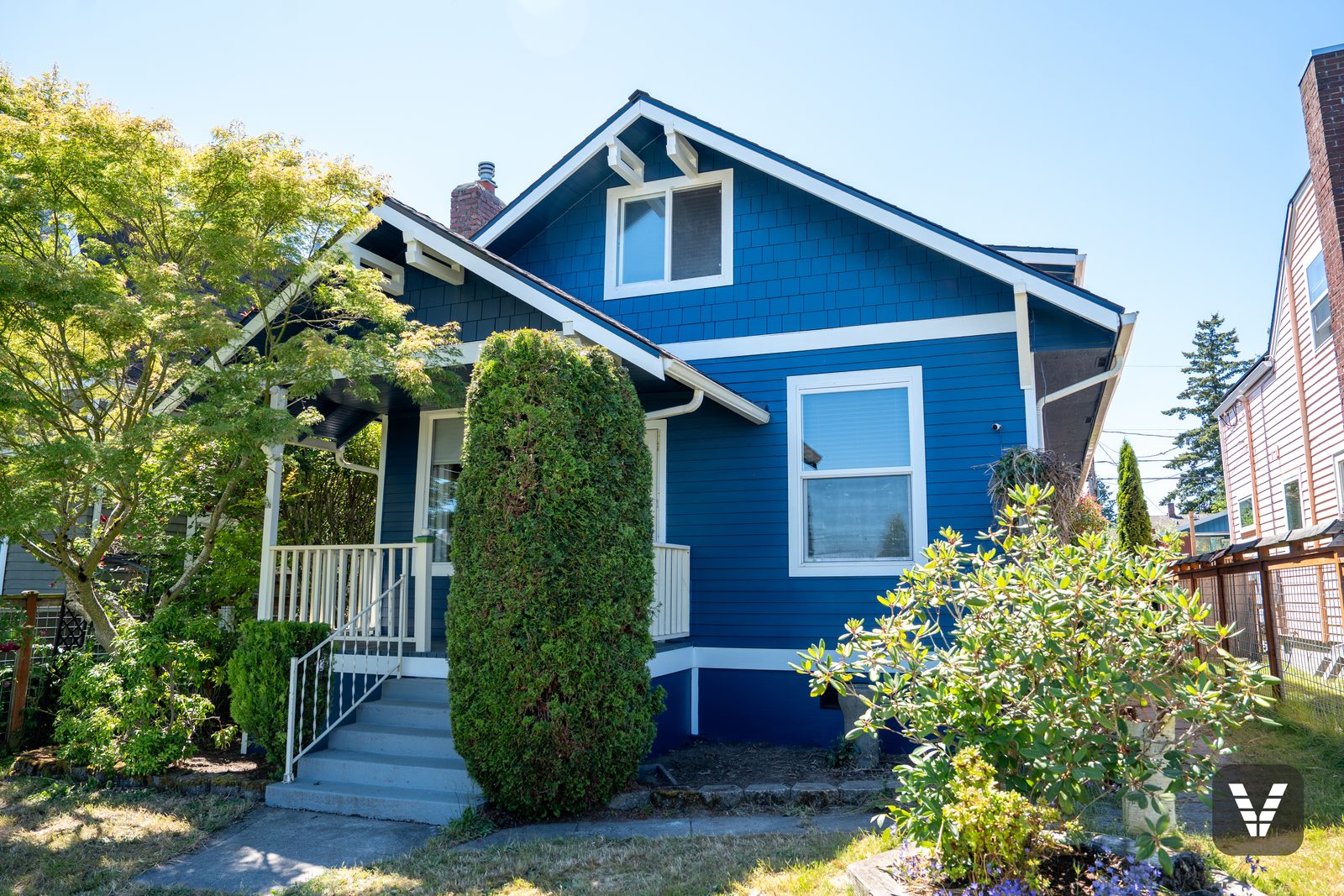 The porch corner — cream rails and Loyal Blue lap