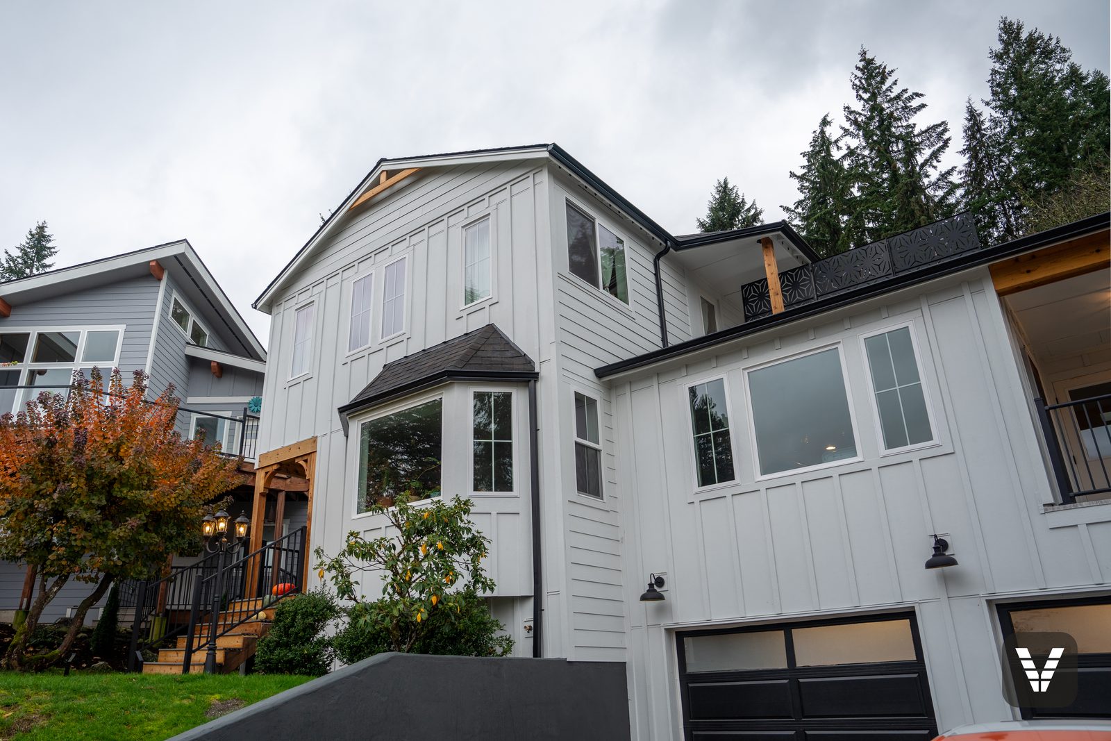 Bay window wrapped in Arctic White HardieTrim with new Milgard Trinsic V300 windows — Siding & Window Vault project in Bellingham, WA