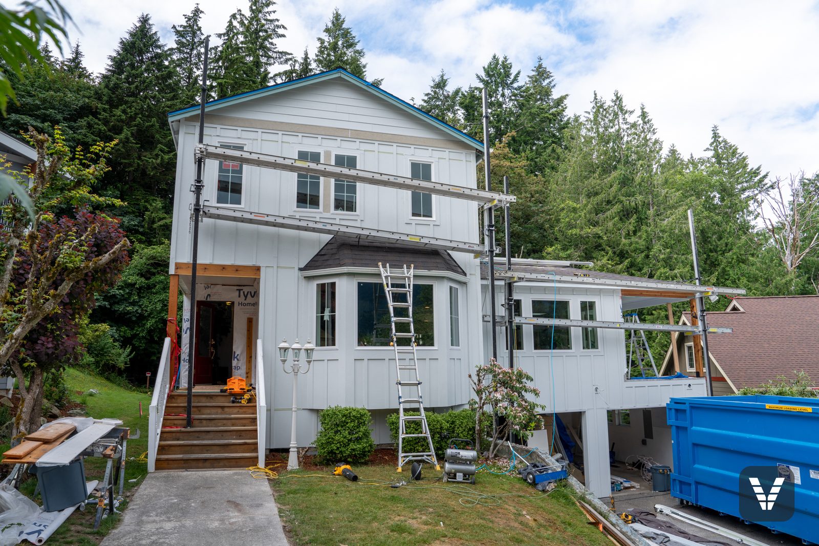 Mid-project in Bellingham — scaffolding up, Tyvek weather barrier in, new Hardie siding going on