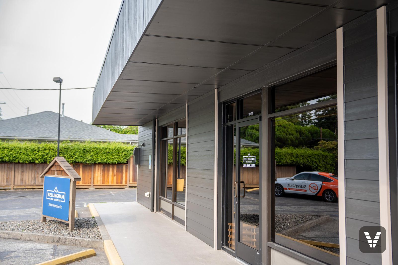 Covered entry walkway with the redesigned overhang and new HardiePlank lap siding — Siding & Window Vault project in Bellingham, WA