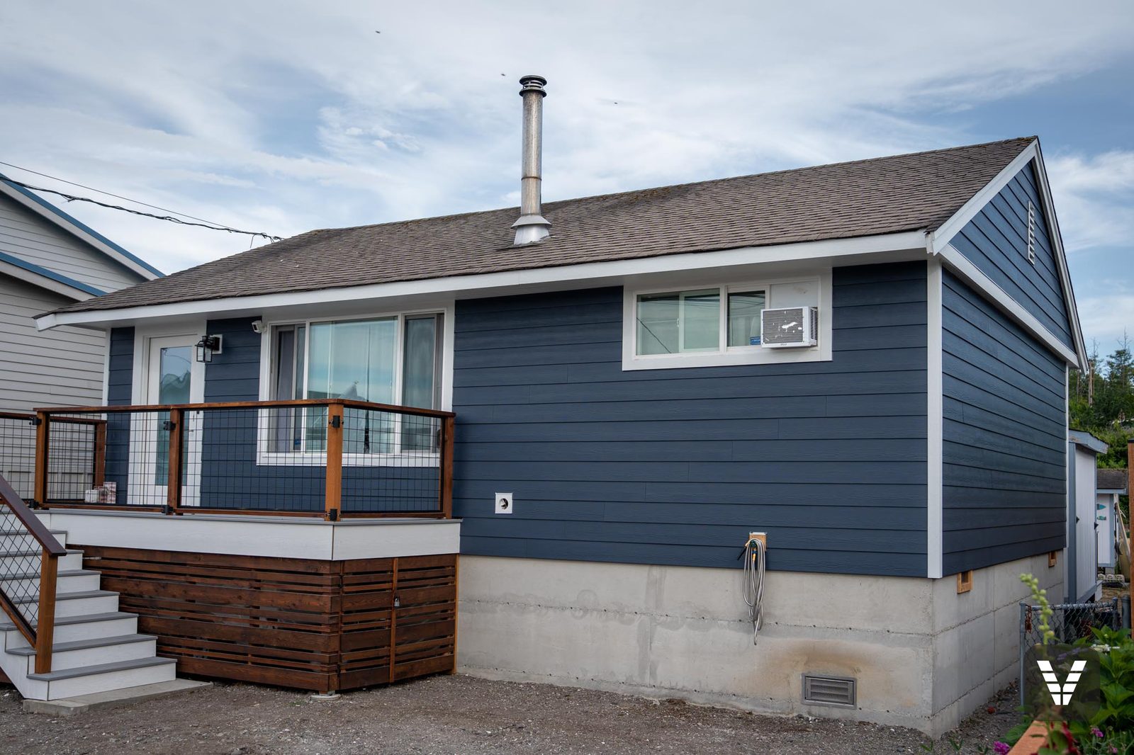 Completed Deep Ocean James Hardie re-side with Arctic White trim on a Birch Bay beach cottage