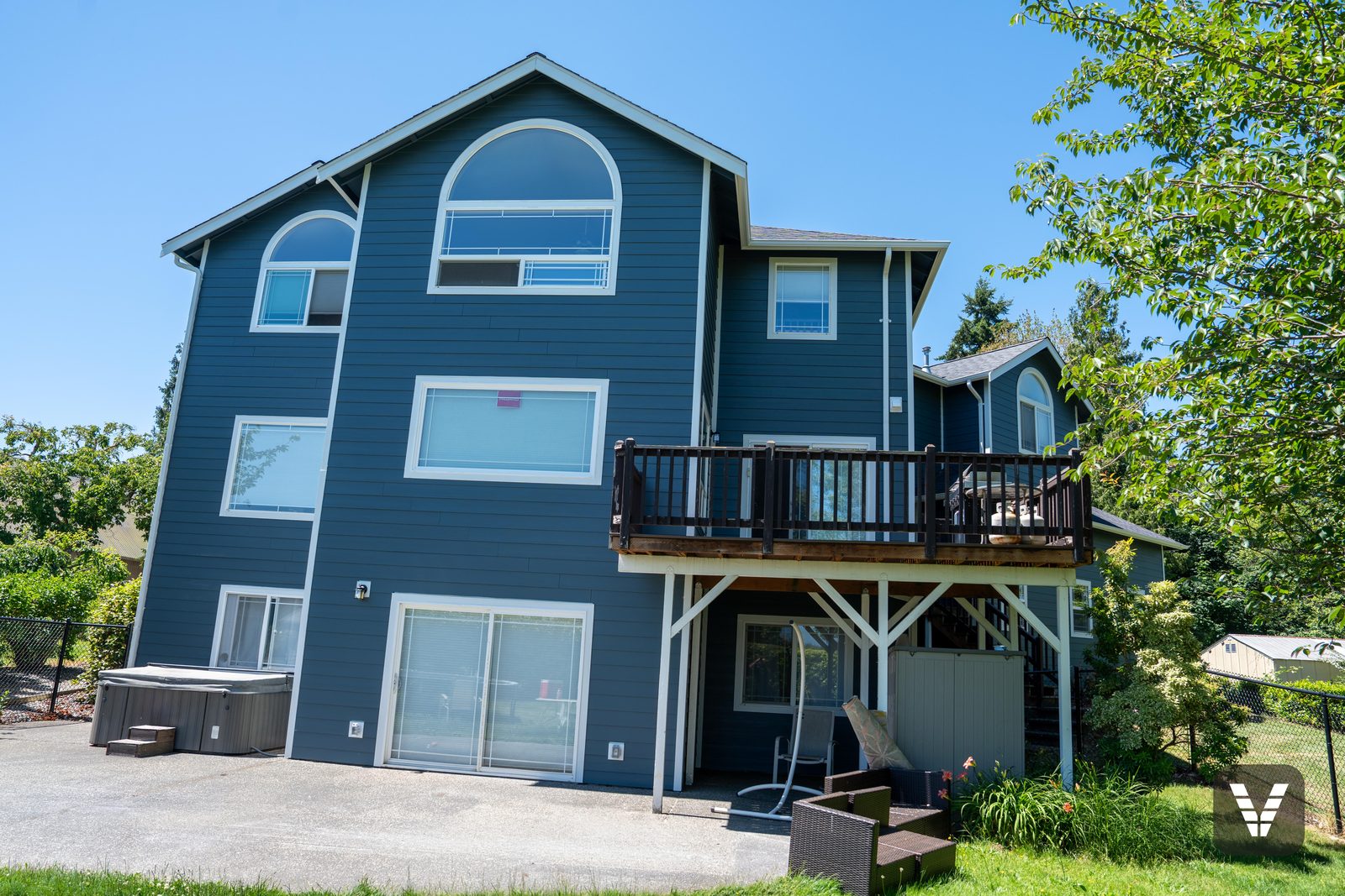 Under the rear deck — posts, skirting, and fresh siding — Siding & Window Vault project in Bellingham, WA