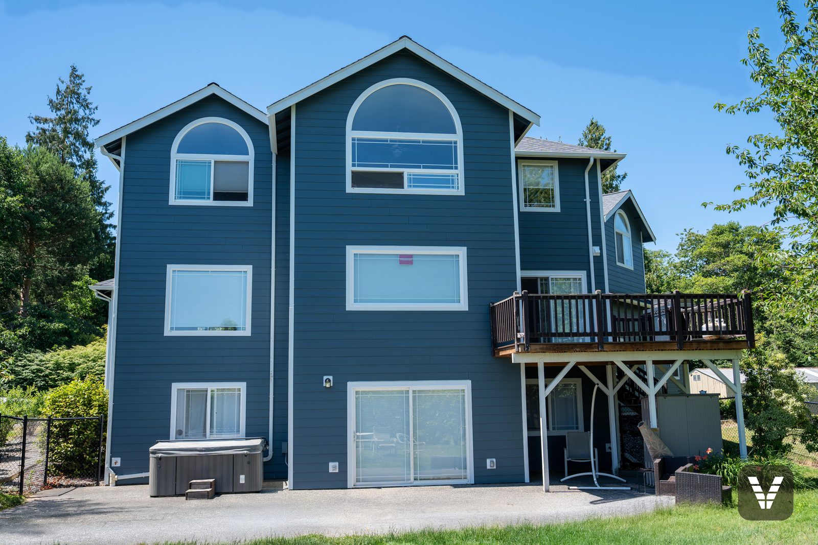 The rear elevation, three stories of new lap and trim — Siding & Window Vault project in Bellingham, WA