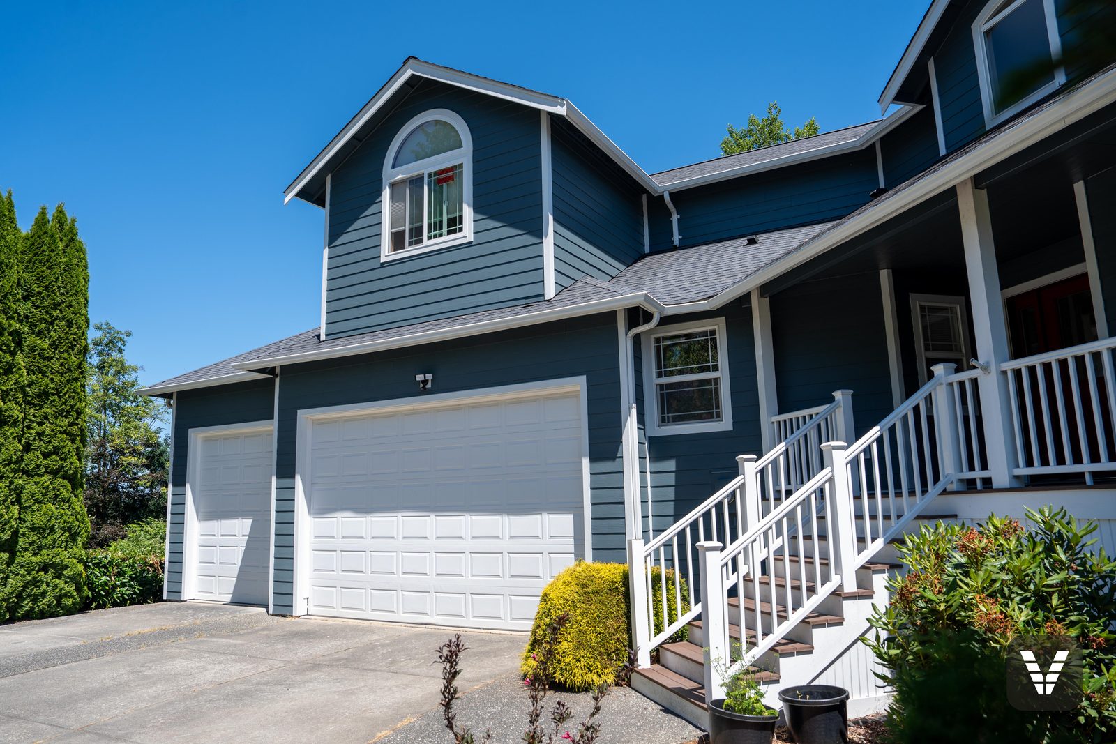 The three-car garage wing and new entry stairs — Siding & Window Vault project in Bellingham, WA