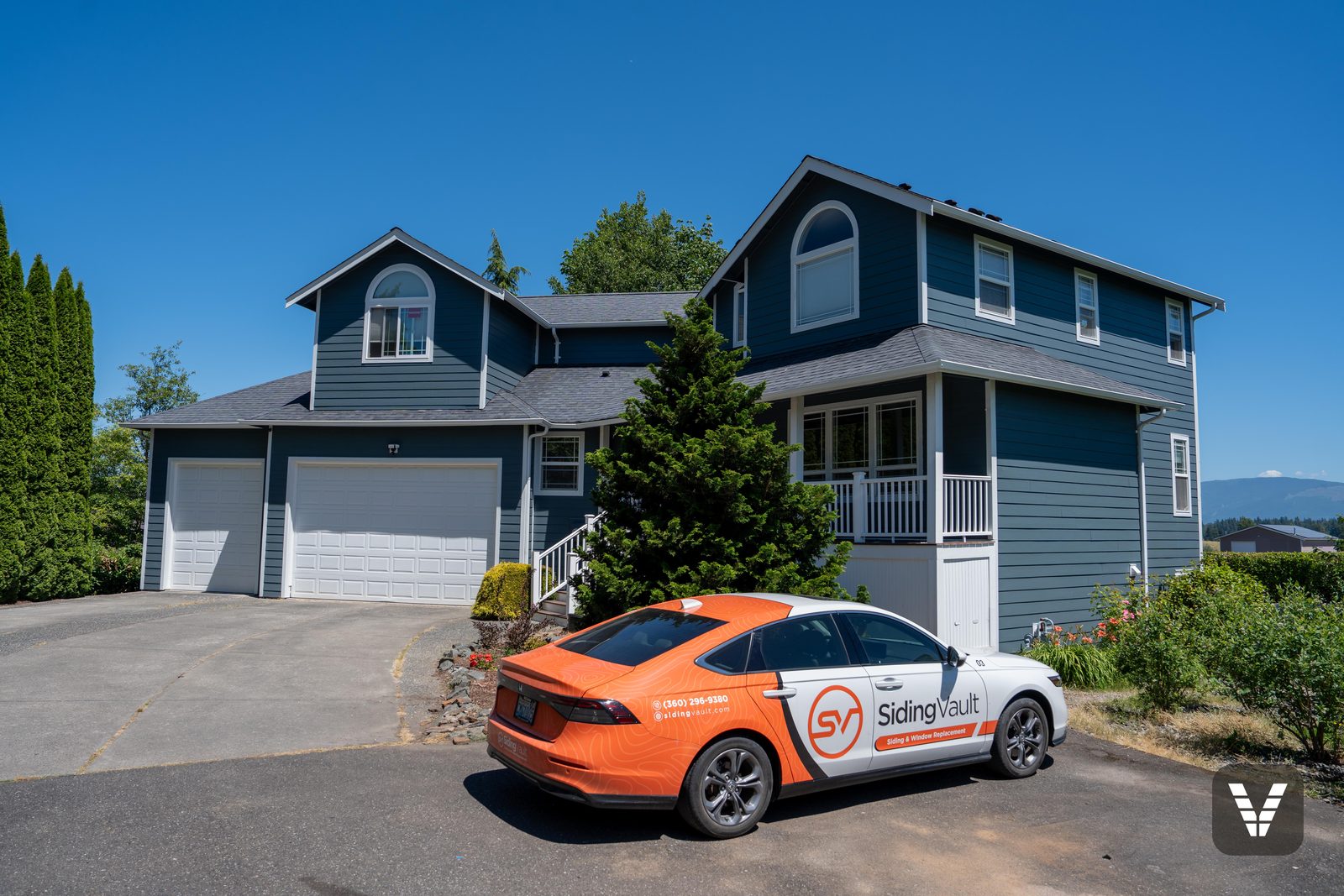 The finished front from the driveway, Siding Vault car below the gables
