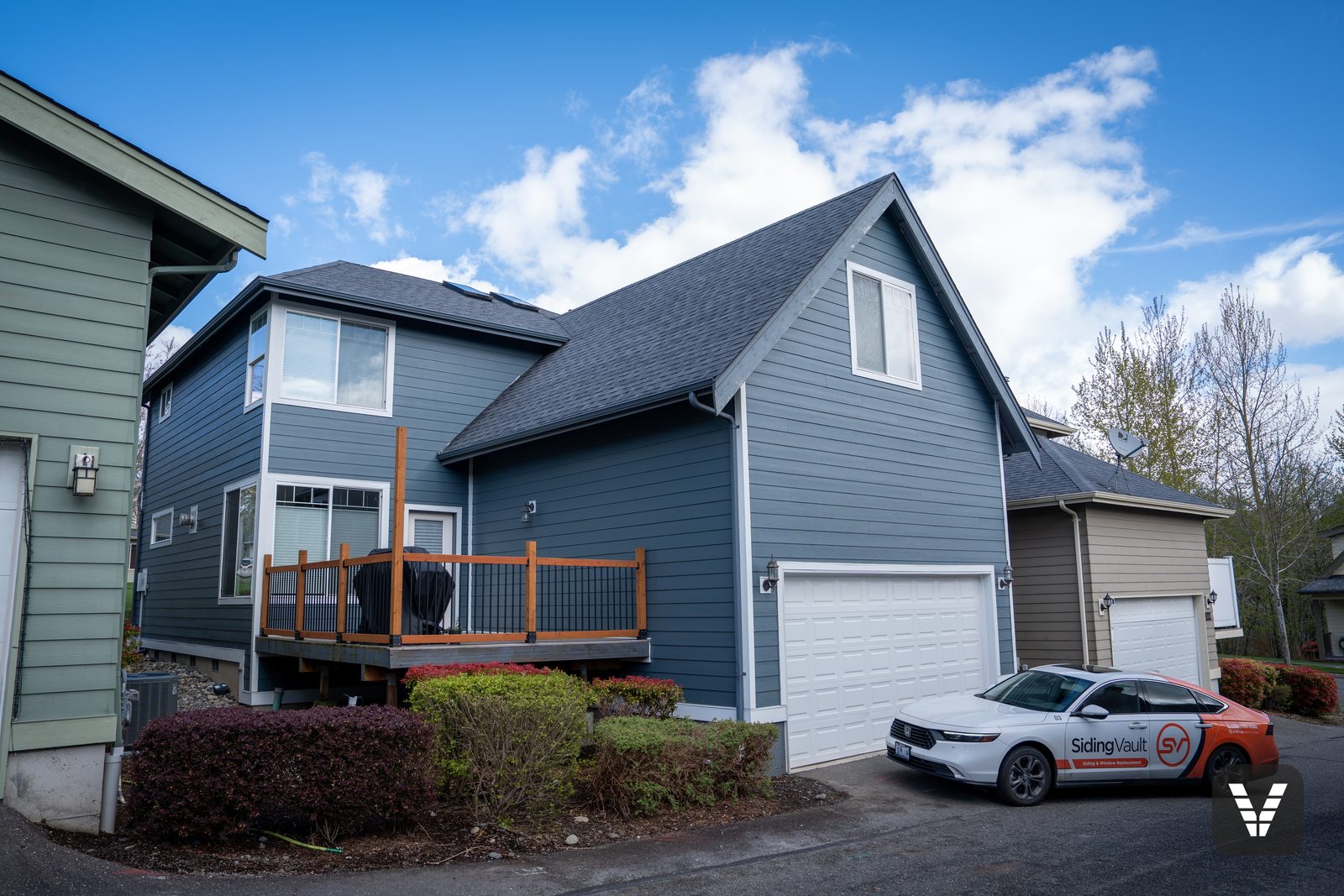 The finished view — rear garage — hardie delivery staged in the before