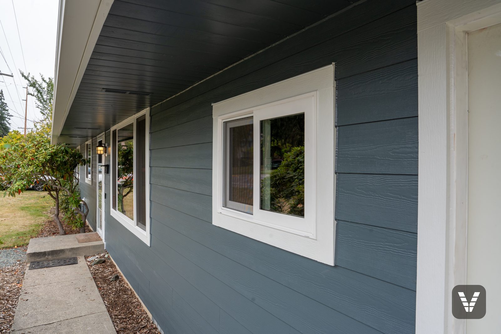 A new Milgard sliding window on the front wall, trimmed in HardieTrim