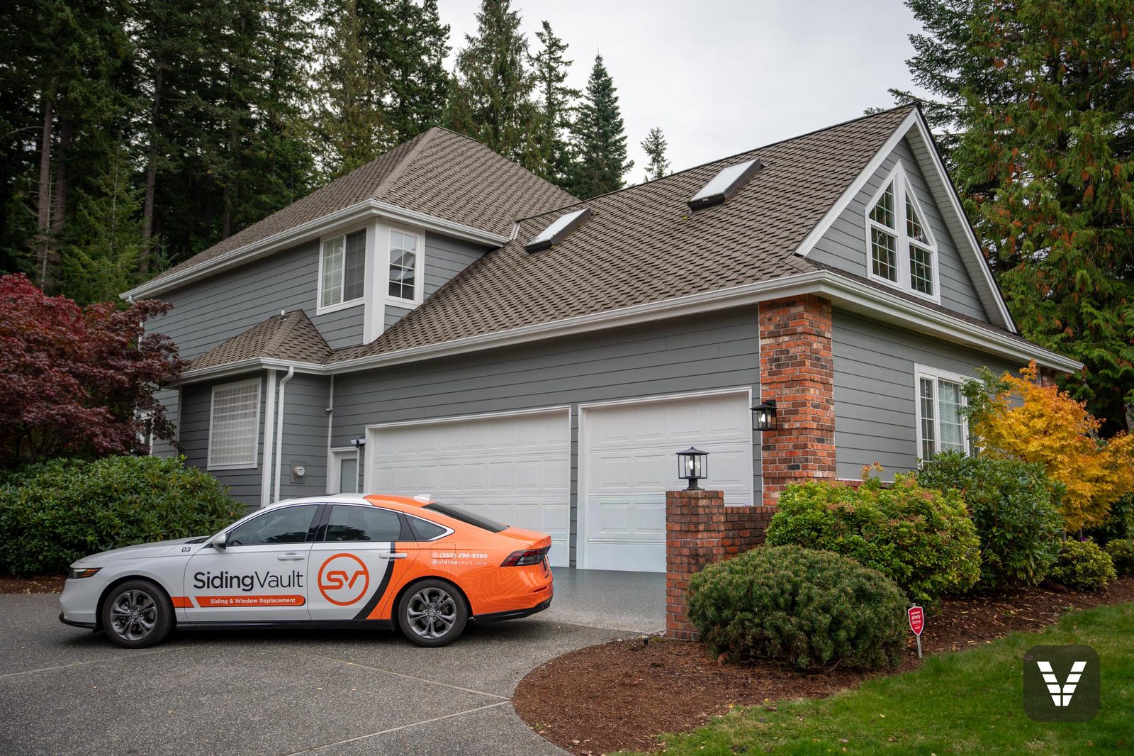 The finished home from the driveway, Siding Vault car out front
