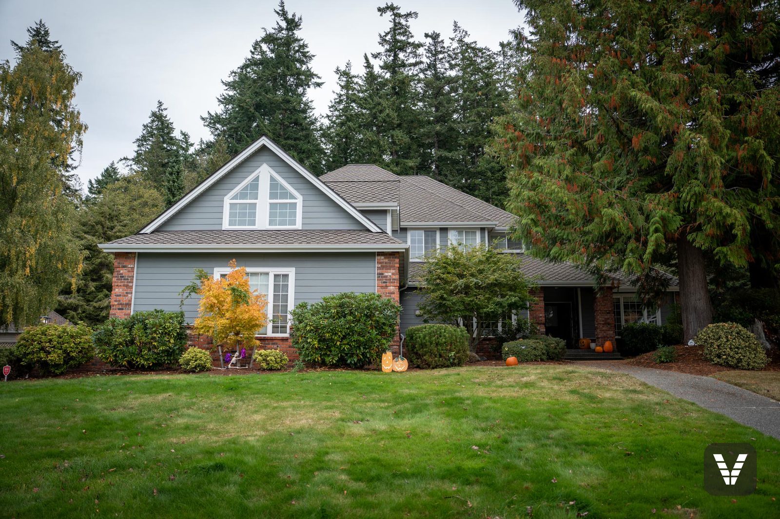 Completed Gray Slate James Hardie re-side with brick accents in Anacortes, WA