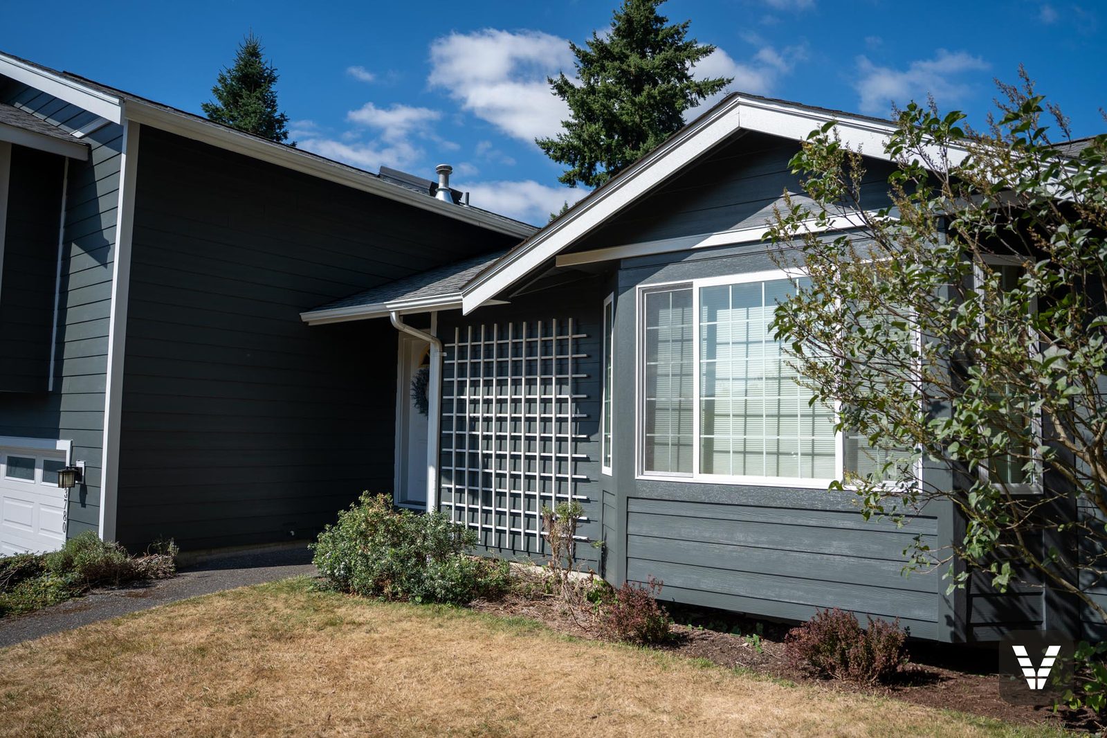 Bay window and trellis wing — lap above, Hardie panel skirt below