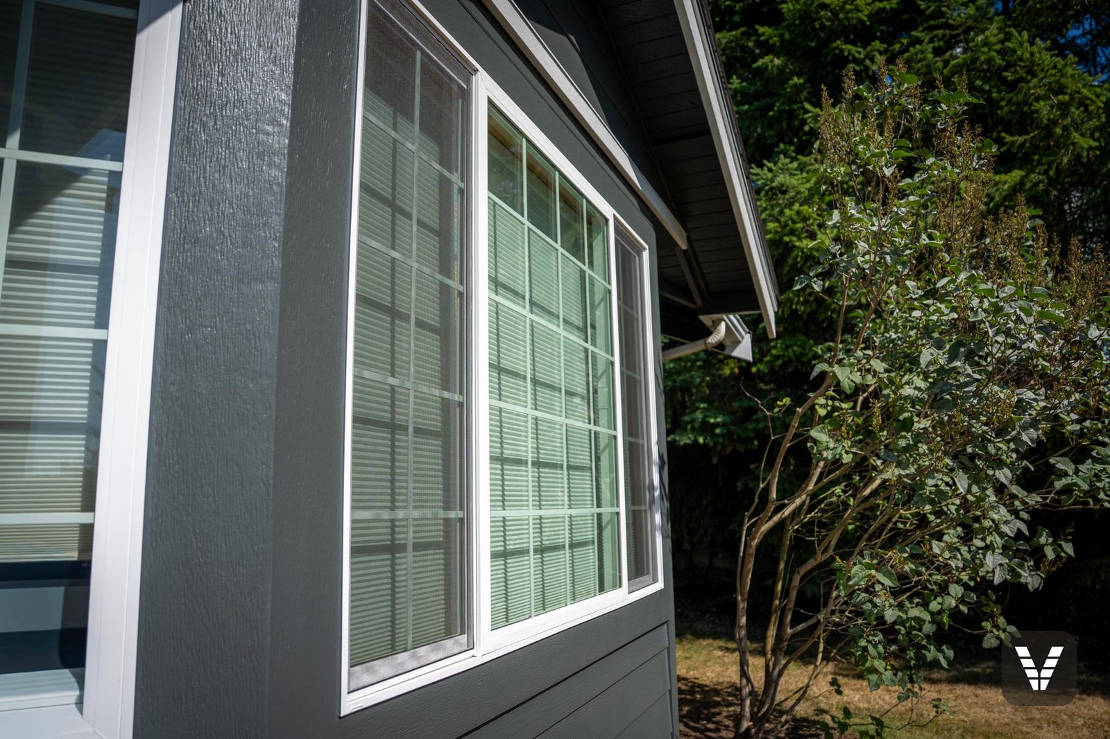 Close-up of a new Milgard Trinsic V300 window, flashed and trimmed in Hardie on a Bellingham re-side