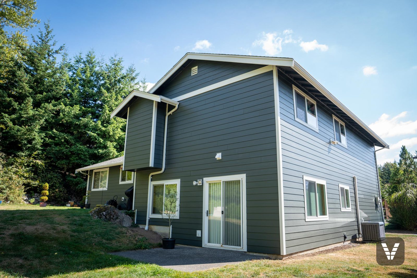 Rear two-story corner with new upstairs windows
