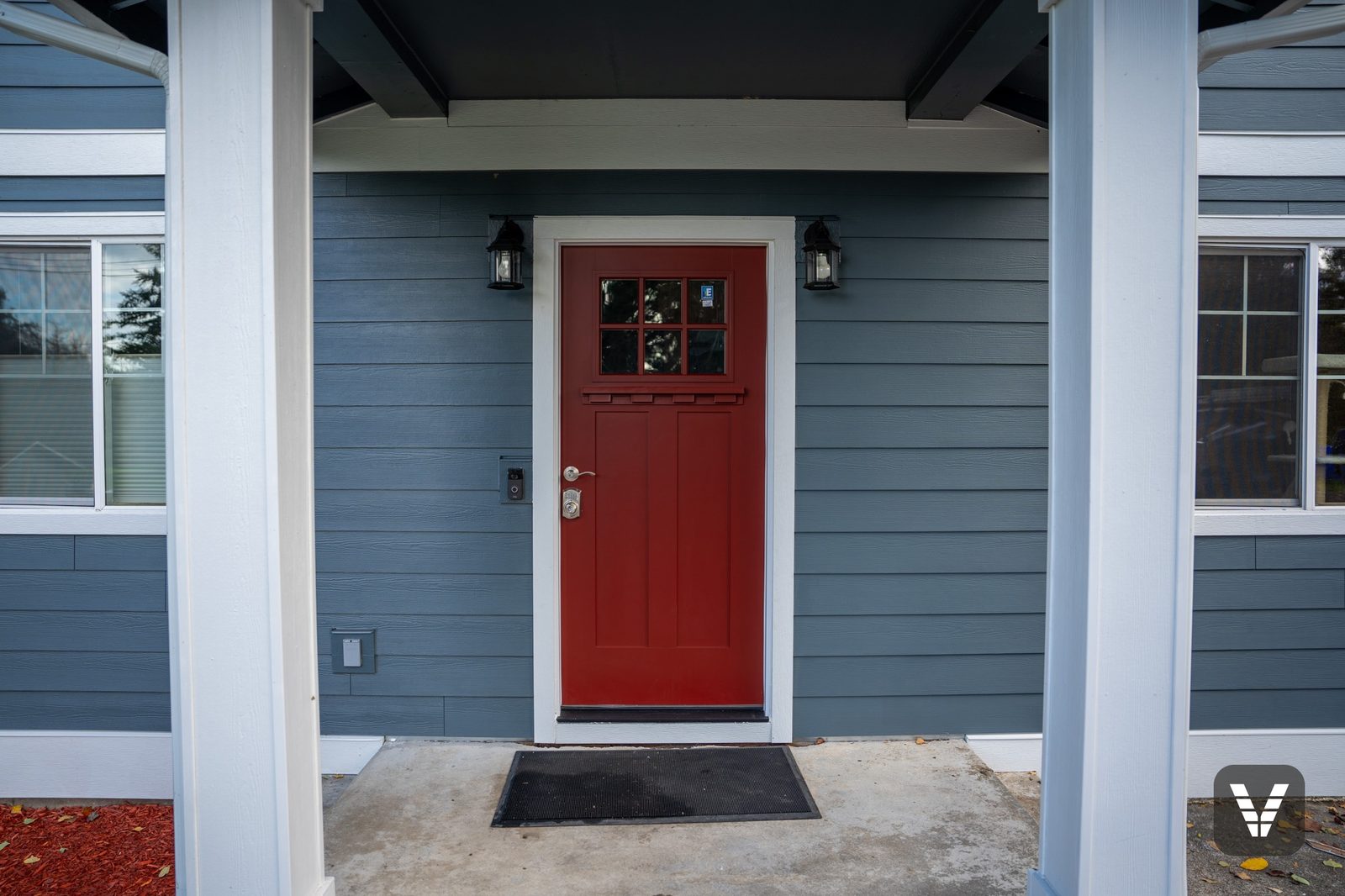 The new entry door and porch, Evening Blue lap wrapping the wall
