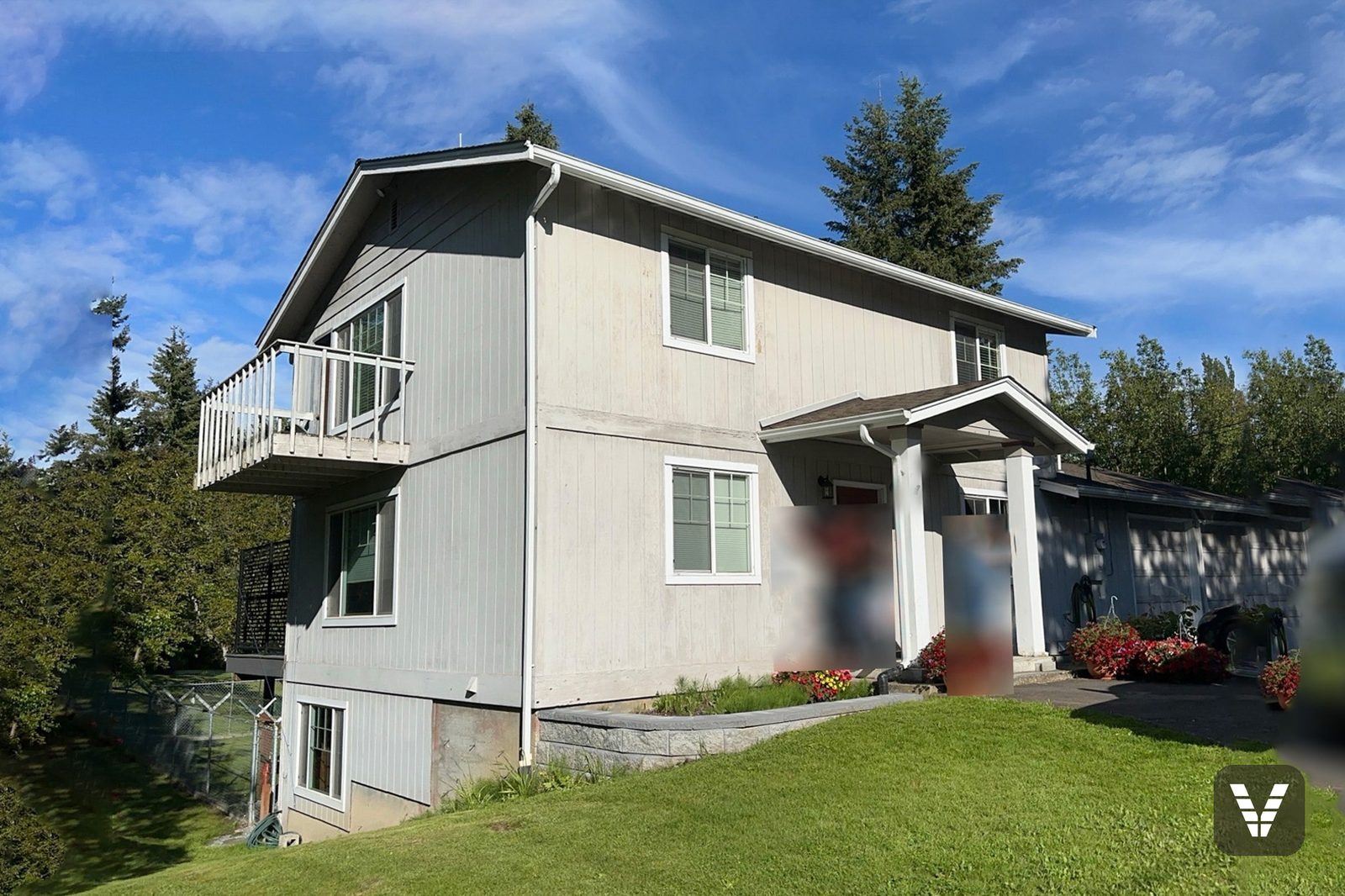 The same Ferndale home before the re-side, in weathered vertical panel siding