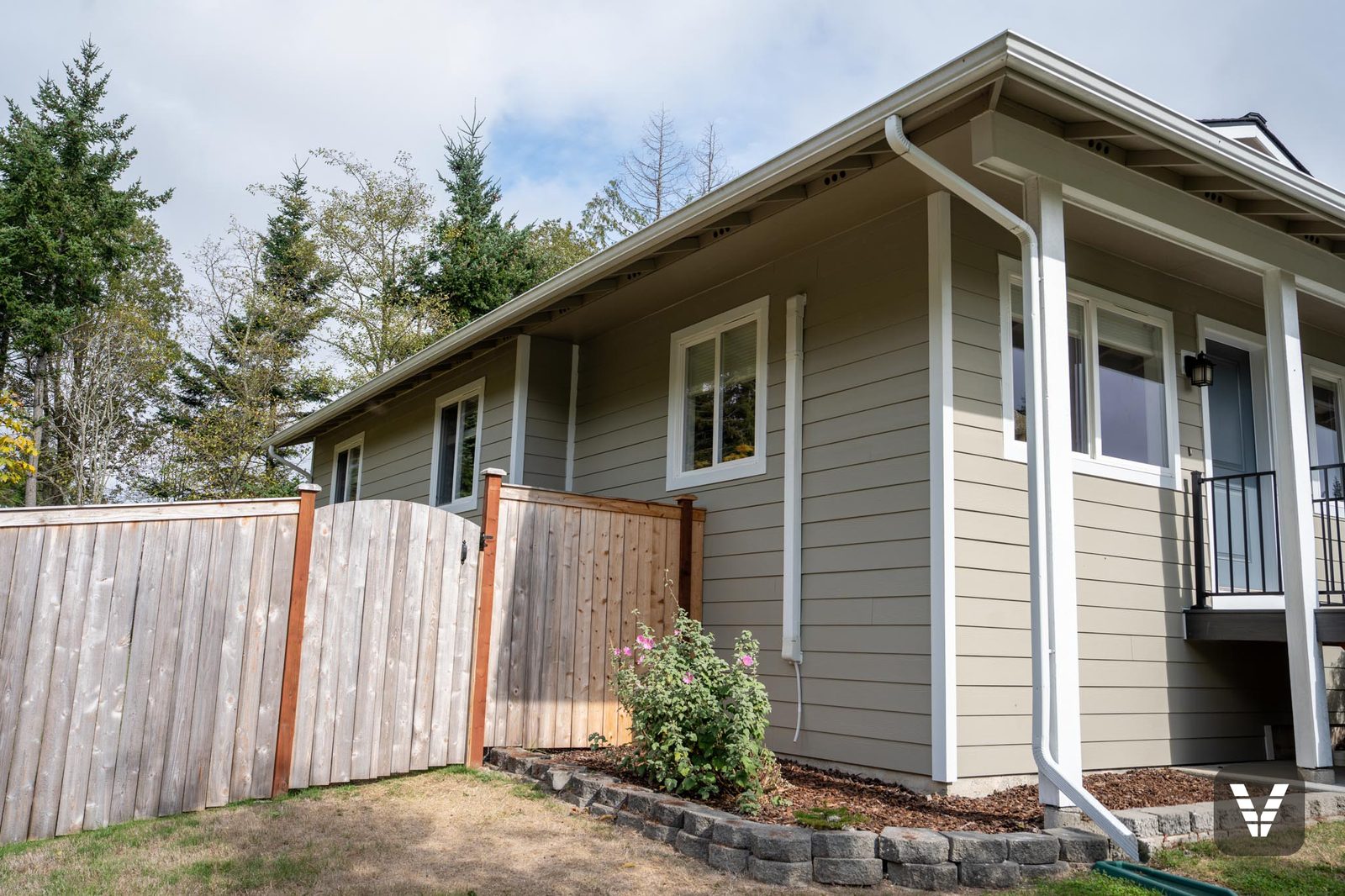 Side windows trimmed in Arctic White along the fence line