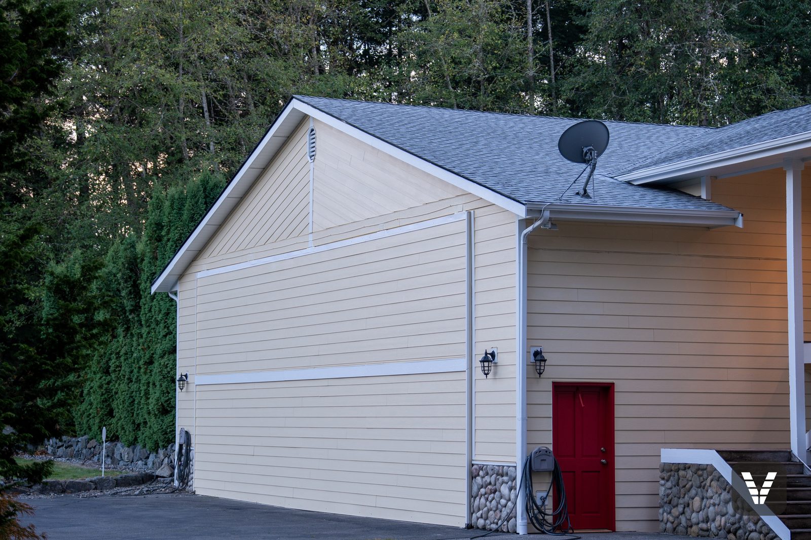 Hangar gable with the main house beyond