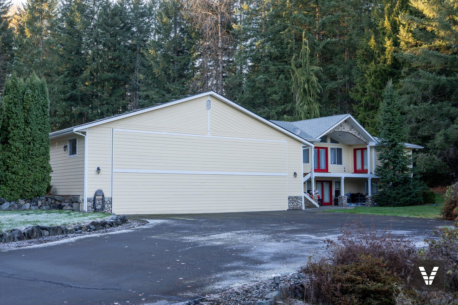 Frosty morning — the hangar wall and house with new roofs